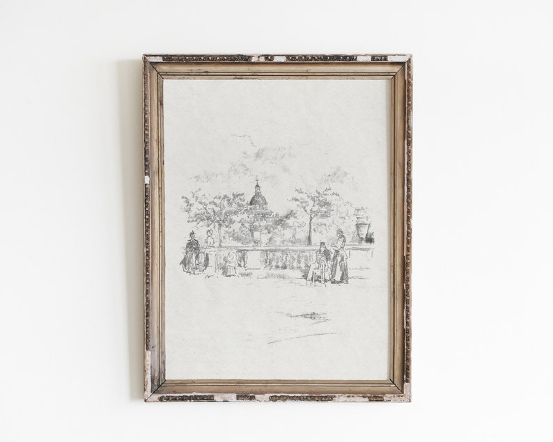 May include: A framed black and white pencil drawing of a city scene with a church in the background and people walking in the foreground.
