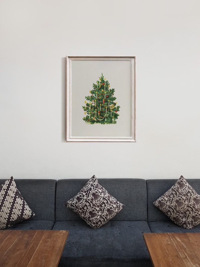 May include: A framed vintage illustration of a Christmas tree decorated with candles and ornaments.