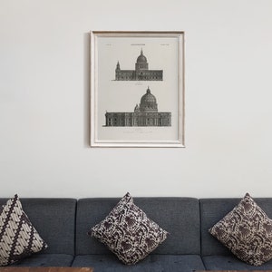 Peut inclure: Un dessin architectural en noir et blanc encadr&eacute; de deux b&acirc;timents avec des d&ocirc;mes. Le dessin est intitul&eacute; "Architecture" et est encadr&eacute; dans un cadre blanc.