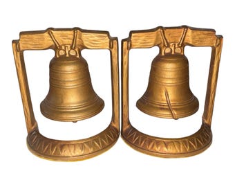 Sujetalibros de metal fundido con forma de campana de la libertad agrietada de estilo vintage