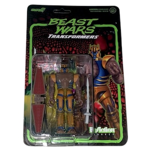以下が含まれることがあります： オリジナルパッケージに入ったビーストウォーズトランスフォーマーのアクションフィギュア。フィギュアは茶色、黄色、青色で、赤いシールドと白い剣が付いています。パッケージには「BEAST WARS TRANSFORMERS」の文字と緑と黒のデザインが施されています。