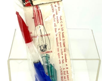 vintage 1970s toys cap rockets and parachute jumper 