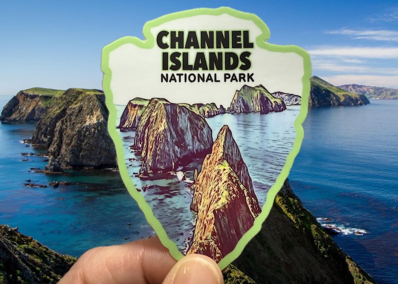 May include: A green and white sticker with a drawing of a rocky island landscape and the text "Channel Islands National Park".
