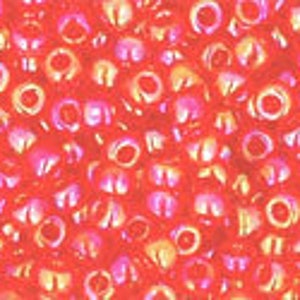May include: A seamless pattern of red, orange, and pink circles with a white outline. The circles are arranged in a random pattern and overlap each other.
