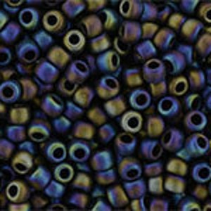 May include: A close-up of a large quantity of small, round, iridescent glass beads. The beads are a mix of dark blue, purple, and brown colors.