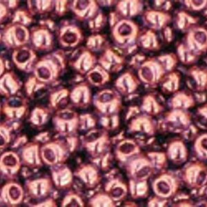 May include: A close-up image of a large quantity of small, round, metallic beads. The beads are a deep, rich purple color with a slight sheen.