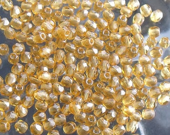 1 lot 25 faceted beads 3mm Topaz or amber color
