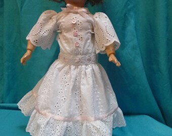 Sweet white embroidered cloth makes for a charming frock with pale pink accents for 15-16 in. doll