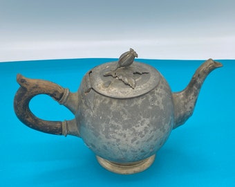 Vintage metal tea pot with poppy flowers