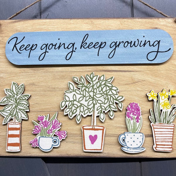 Keep going, keep growing cut out pieces to make this sign. Includes sign, oval and five plants