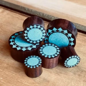 PAIR of Crushed Turquoise Tribal Sunburst Inlaid Sono Wood Saddle Plugs - Gauges 00g (10mm) through 1&quot; (25mm) available