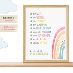 May include: A framed print with a rainbow design and text that reads "Ich bin sicher, Ich bin wertvoll, Ich bin einzigartig, Ich bin wundervoll, Ich bin mutig und stark, Ich kann alles schaffen, Ich h&ouml;re auf mein Herz, Ich werde geliebt, Ich glaube an mich. So wie ich bin, bin ich genau richtig!"