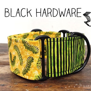 May include: A black and yellow patterned dog collar with black hardware. The collar has a green and black striped pattern on one side and a yellow and green caterpillar pattern on the other side.