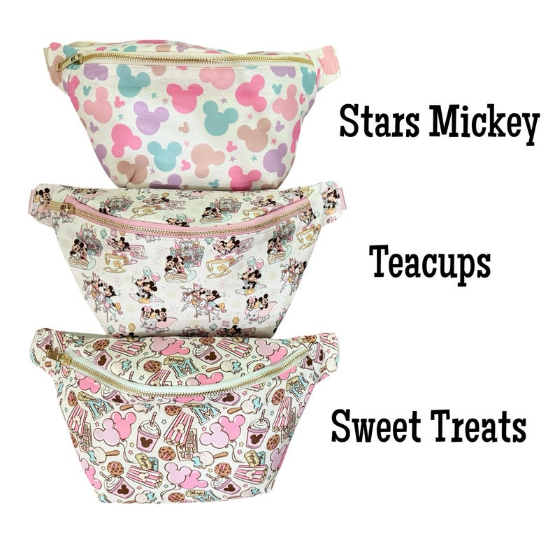 May include: Three fanny packs with different patterns. The top pack has a white background with pink, blue, and purple Mickey Mouse shapes. The middle pack has a white background with a Mickey Mouse teacup design. The bottom pack has a white background with a sweet treats design. The text "Stars Mickey", "Teacups", and "Sweet Treats" are visible.
