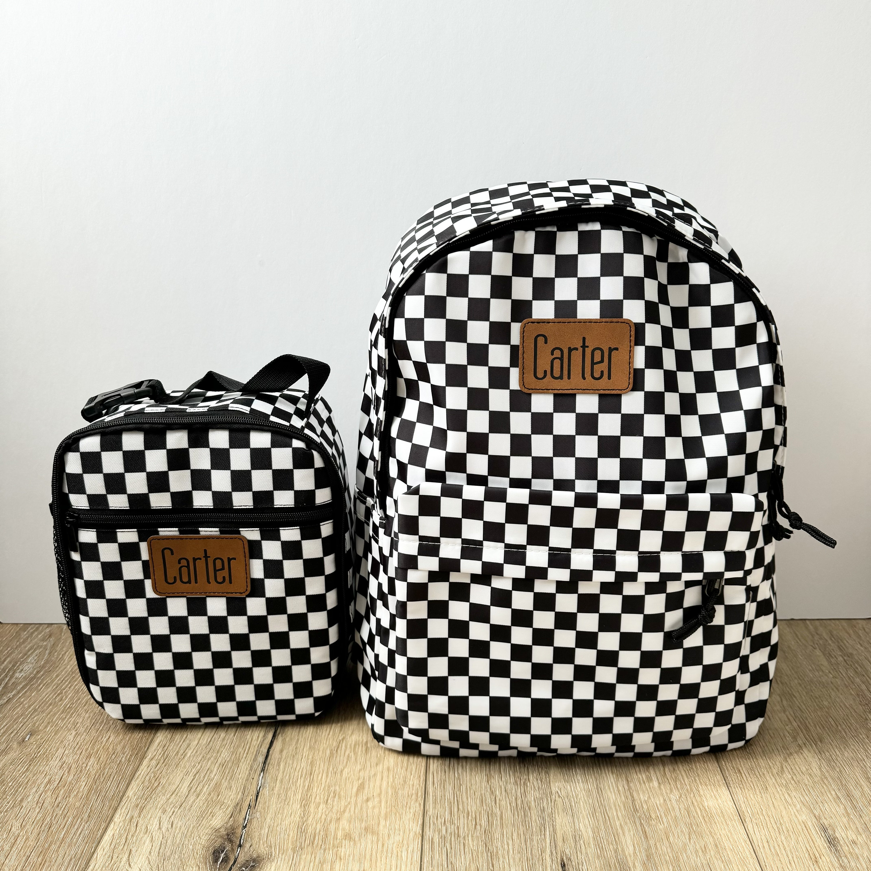 checker leather backpack KRUK Checkered PRJKT8 The main material of this product is made with at least 30% bio Burberry Embossed Check Backpack