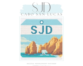 May include: A digital needlepoint pattern featuring a pixelated image of the Cabo San Lucas rock formations. The design includes the letters "SJD" in a light blue banner, with the words "Cabo San Lucas" above. The pattern is set against a white background.
