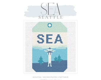 May include: A digital needlepoint pattern featuring a stylized design of the Seattle Space Needle. The design includes the text "SEA" and "SEATTLE" in a blue and white color scheme, with a light blue background.