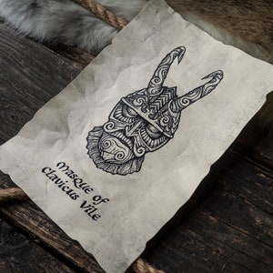 May include: A black and white illustration of a mask with horns and intricate details. The text "Masque of Clavicus Vile" is written below the mask.