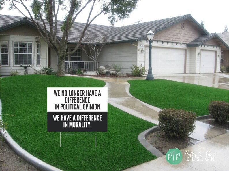 anti trump signs for protests in front yard that reads We no longer have a difference in political opinion, we have a difference in morality