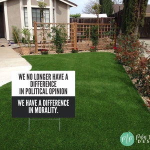 anti trump yard sign with political message about morality in front yard of house
