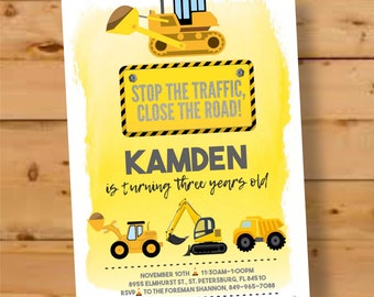 May include: Yellow construction vehicle birthday party invitation with the text "STOP THE TRAFFIC, CLOSE THE ROAD!" and "KAMDEN is turning three years old".