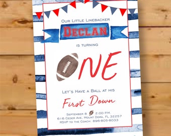 May include: A blue and red football-themed first birthday party invitation with a watercolor background. The invitation says "Our Little Linebacker Declan is turning One. Let's Have a Ball at His First Down." It includes the date, time, address, and RSVP information.
