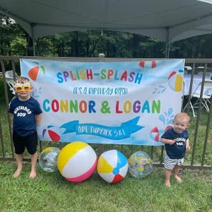 Kids birthday party banner with a Splish Splash theme, featuring watercolor beach balls, life preservers, and rainbow primary colors