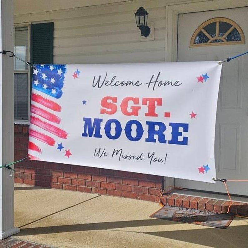 Custom “Welcome Home” banner on front porch for a soldier homecoming celebration