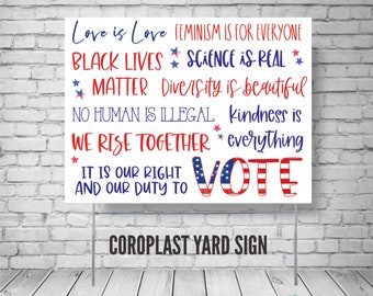 May include: White coroplast yard sign with red, white, and blue text. The sign includes phrases such as "Love is Love", "Black Lives Matter", and "Vote". The sign is supported by metal stakes and is displayed against a white brick wall.
