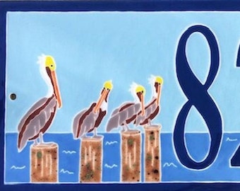 Pelican on Poles address tile
