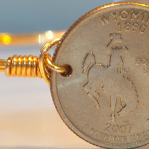 Wyoming state quarter wire bangle bracelet.
