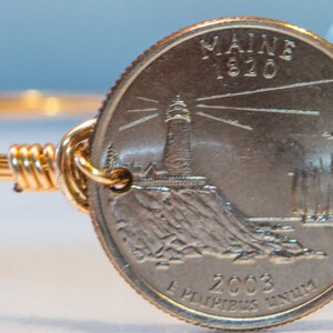 Maine state quarter wire bangle bracelet.