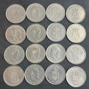 May include: A collection of sixteen silver-colored Danish one krone coins arranged in a four-by-four grid. Each coin features either a profile portrait of a monarch or a royal coat of arms with the text 1 KRONE and various production years.