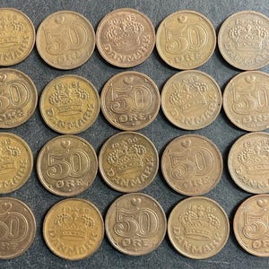 May include: A collection of twenty bronze-colored Danish 50 øre coins arranged in a grid. Each coin features a central crown, the number 50, the word ØRE, the text DANMARK, a small heart symbol, and a specific year ranging from 1989 to 2005.