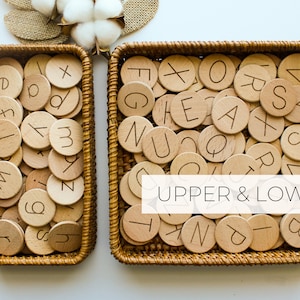 May include: Two wicker baskets filled with wooden alphabet tiles. The tiles have both uppercase and lowercase letters. The text "UPPER & LOWER" is printed on the image.