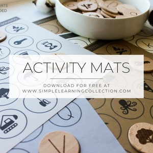 May include: A set of printable activity mats with various images, such as a jellyfish, octopus, and a tree. The mats are designed for use with wooden tokens, which are shown in a bowl in the background. The text "ACTIVITY MATS" is displayed in a white rectangle in the center of the image. The text "DOWNLOAD FOR FREE AT WWW.SIMPLELEARNINGCOLLECTION.COM" is displayed below the title.