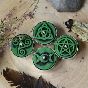 Create detailed small ritual pieces with this witchcraft symbols mold for tealight candles, designed with 4 cavities: Triskelion, Triple Moon, Pentagram, and Triquetra. This food grade silicone candle mold is sized to match US and EU tealight standards.
Candle mold, wiccan mold, pagan mold, Celtic molds, metaphysical mold, pagan silicone mold, wax melts mold, witchcraft mold, symbols mold, mold for tealight, magic mold, spiritual mold, wicca mould
