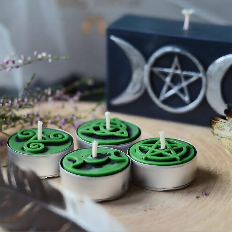 Create detailed small ritual pieces with this witchcraft symbols mold for tealight candles, designed with 4 cavities: Triskelion, Triple Moon, Pentagram, and Triquetra. This food grade silicone candle mold is sized to match US and EU tealight standards.
Candle mold, wiccan mold, pagan mold, Celtic molds, metaphysical mold, pagan silicone mold, wax melts mold, witchcraft mold, symbols mold, mold for tealight, magic mold, spiritual mold, wicca mould