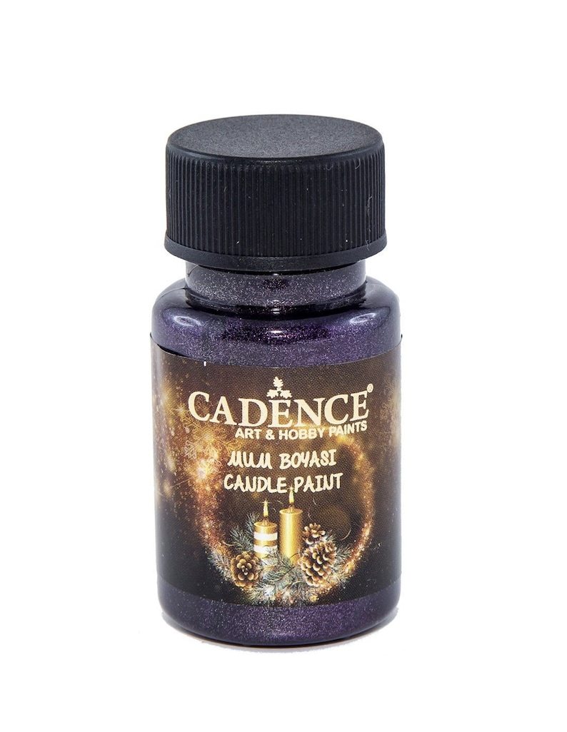 May include: A small bottle of purple metallic candle paint by Cadence Art & Hobby Paints. The bottle has a black cap and a label that says "Mum Boyasi Candle Paint".