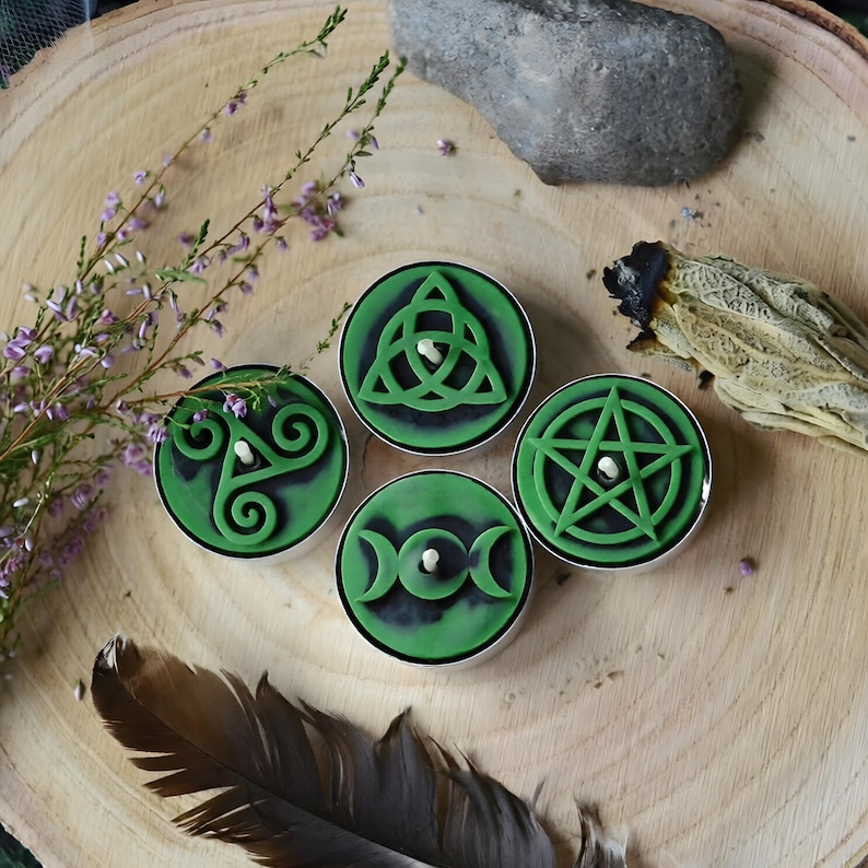 Create detailed small ritual pieces with this witchcraft symbols mold for tealight candles, designed with 4 cavities: Triskelion, Triple Moon, Pentagram, and Triquetra. This food grade silicone candle mold is sized to match US and EU tealight standards.
Candle mold, wiccan mold, pagan mold, Celtic molds, metaphysical mold, pagan silicone mold, wax melts mold, witchcraft mold, symbols mold, mold for tealight, magic mold, spiritual mold, wicca mould