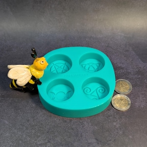 Create detailed small ritual pieces with this witchcraft symbols mold for tealight candles, designed with 4 cavities: Triskelion, Triple Moon, Pentagram, and Triquetra. This food grade silicone candle mold is sized to match US and EU tealight standards.
Candle mold, wiccan mold, pagan mold, Celtic molds, metaphysical mold, pagan silicone mold, wax melts mold, witchcraft mold, symbols mold, mold for tealight, magic mold, spiritual mold, wicca mould