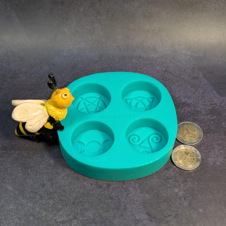 Create detailed small ritual pieces with this witchcraft symbols mold for tealight candles, designed with 4 cavities: Triskelion, Triple Moon, Pentagram, and Triquetra. This food grade silicone candle mold is sized to match US and EU tealight standards.
Candle mold, wiccan mold, pagan mold, Celtic molds, metaphysical mold, pagan silicone mold, wax melts mold, witchcraft mold, symbols mold, mold for tealight, magic mold, spiritual mold, wicca mould