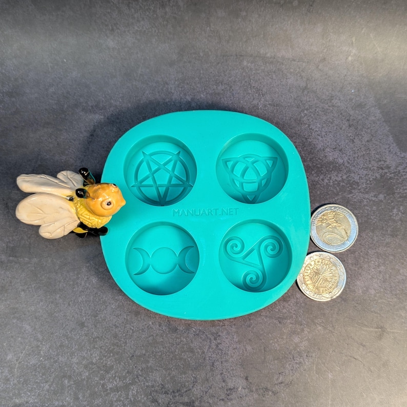 Create detailed small ritual pieces with this witchcraft symbols mold for tealight candles, designed with 4 cavities: Triskelion, Triple Moon, Pentagram, and Triquetra. This food grade silicone candle mold is sized to match US and EU tealight standards.
Candle mold, wiccan mold, pagan mold, Celtic molds, metaphysical mold, pagan silicone mold, wax melts mold, witchcraft mold, symbols mold, mold for tealight, magic mold, spiritual mold, wicca mould