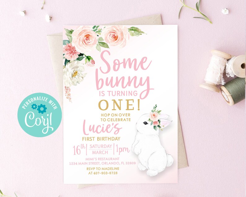 May include: Pink and white floral first birthday invitation with a white bunny rabbit wearing a flower crown. The invitation says "Some bunny is turning one!" and includes the details of the party, including the date, time, location, and RSVP information.