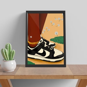 May include: A framed illustration of a person's feet wearing black and white sneakers with a gold chain ankle bracelet. The background is a light orange with white dandelion seeds blowing in the wind.
