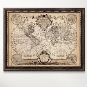 May include: A framed vintage world map print in black and white with a brown frame. The map is titled "Carte-Mondes" and features a decorative border with nautical elements.