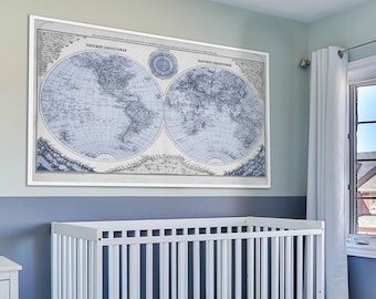 May include: A white crib with a blue and white patterned mattress, a white dresser with three drawers, and a framed world map hanging on the wall. The room is painted in light blue and white.