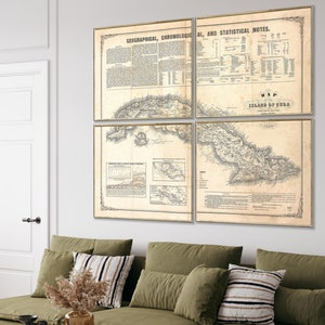 May include: Four framed vintage maps of Cuba hang on a white wall above a green sectional sofa. The maps are in gold frames and feature detailed geographical and statistical information. A round wooden coffee table and a wicker chair complete the living room setting.
