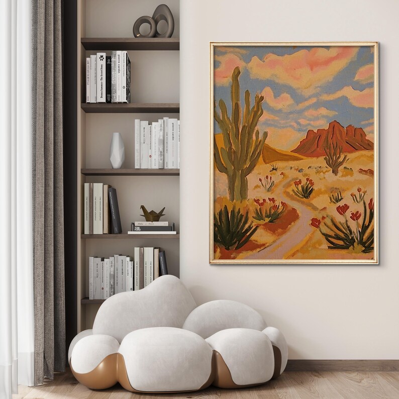 May include: A painting of a desert landscape with a large cactus in the foreground. The sky is a pale blue with pink clouds. The mountains in the background are a reddish brown color.