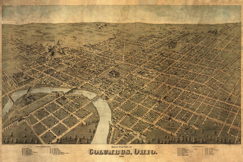 May include: An antique bird's-eye view map of Columbus, Ohio, showing the city's layout and streets. The map is printed on aged paper with a brown and beige color scheme. The text "Bird's Eye View of Columbus, Ohio" is printed at the bottom of the map.